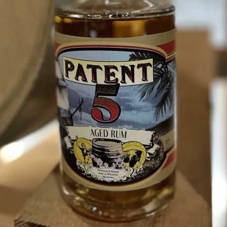 A closeup of a bottle of Patent 5 Rum.